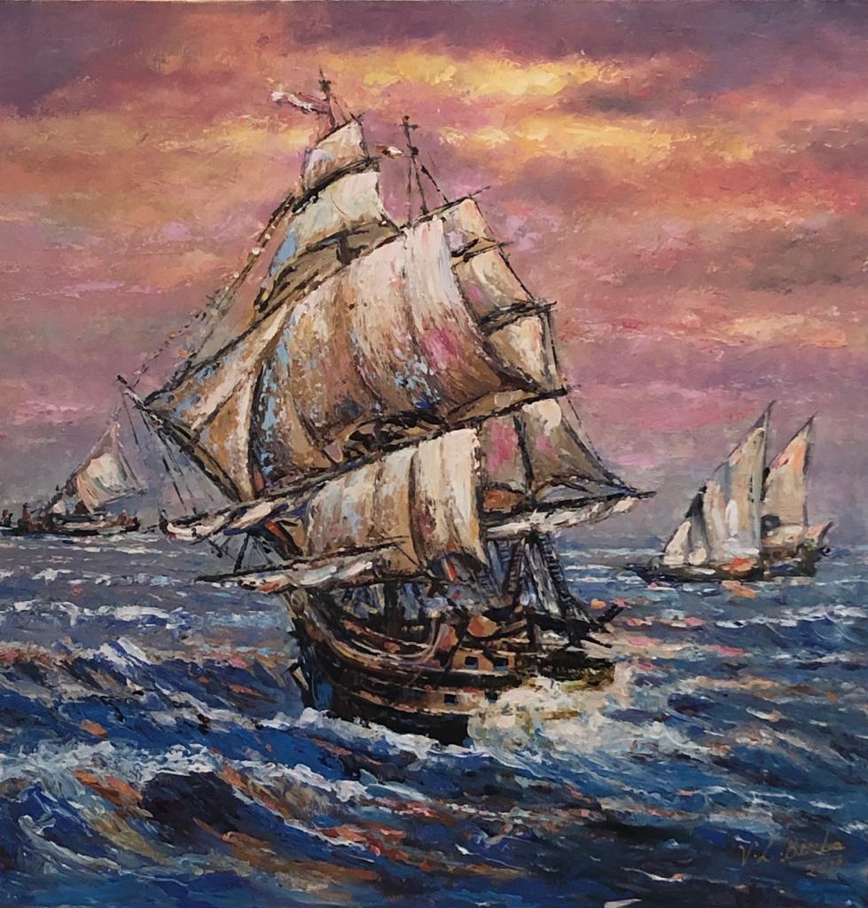 Tall sailing ships silhouetted at sunset