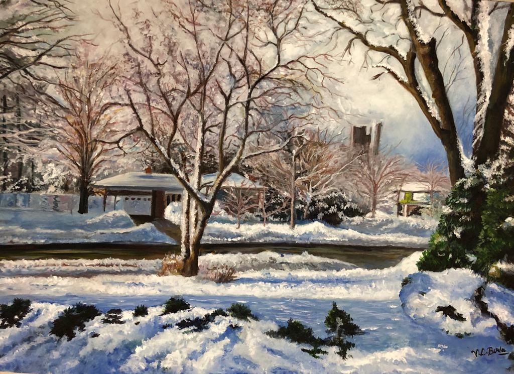 Snow-covered garden and bare trees beneath a soft winter sky