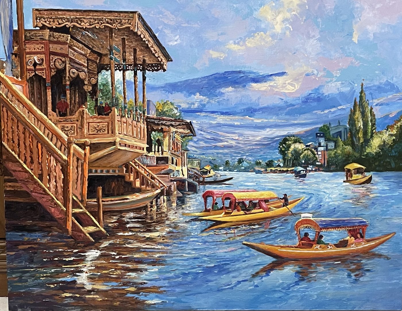 Houseboats and shikaras on Kashmir's Dal Lake beneath mountain peaks
